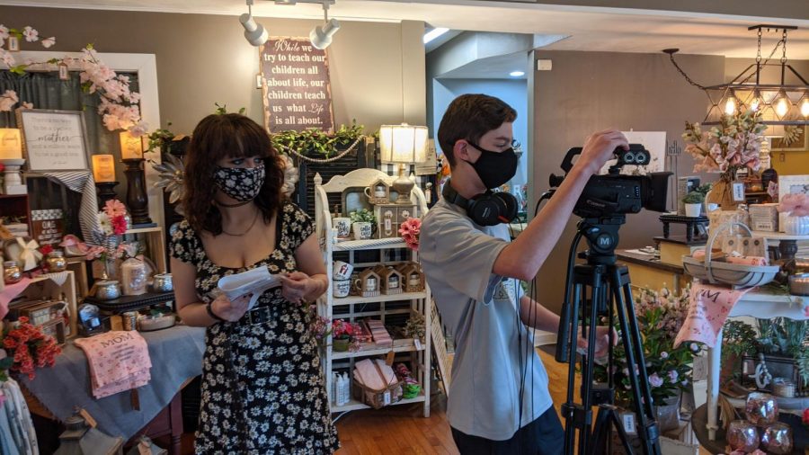 Linea Smith and Jace Denison shooting footage at the Copper Lantern in downtown Farmington.