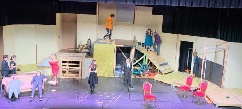 FHS Theater Guild students rehearsing for Clue across an unfinished stage.