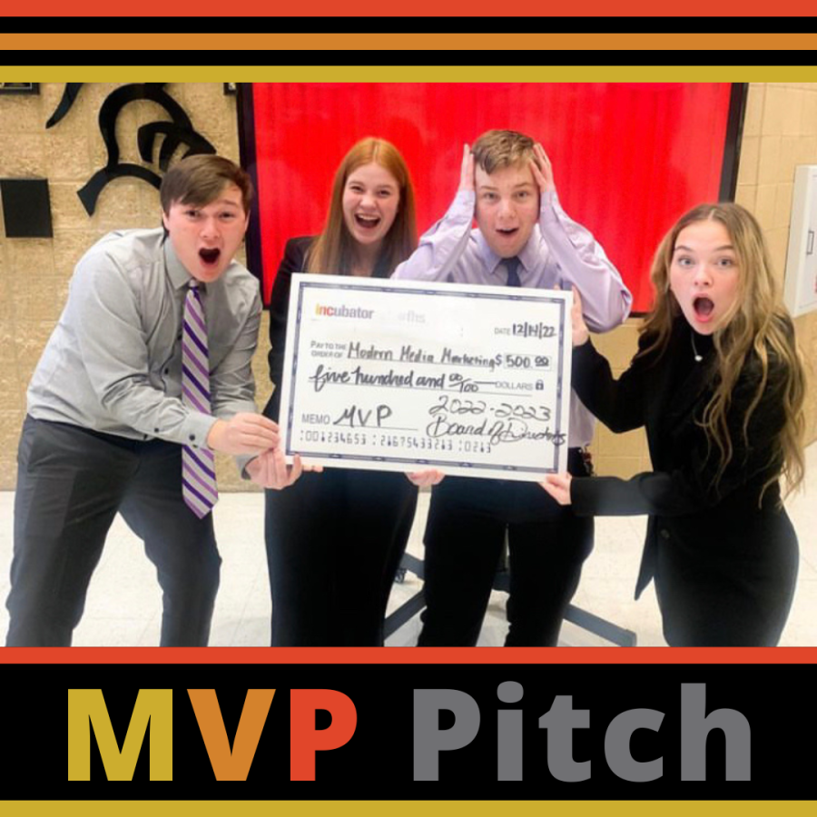 Students from Incubators Modern Media Marketing hold their $500 check that was awarded to them for their MVP pitch.