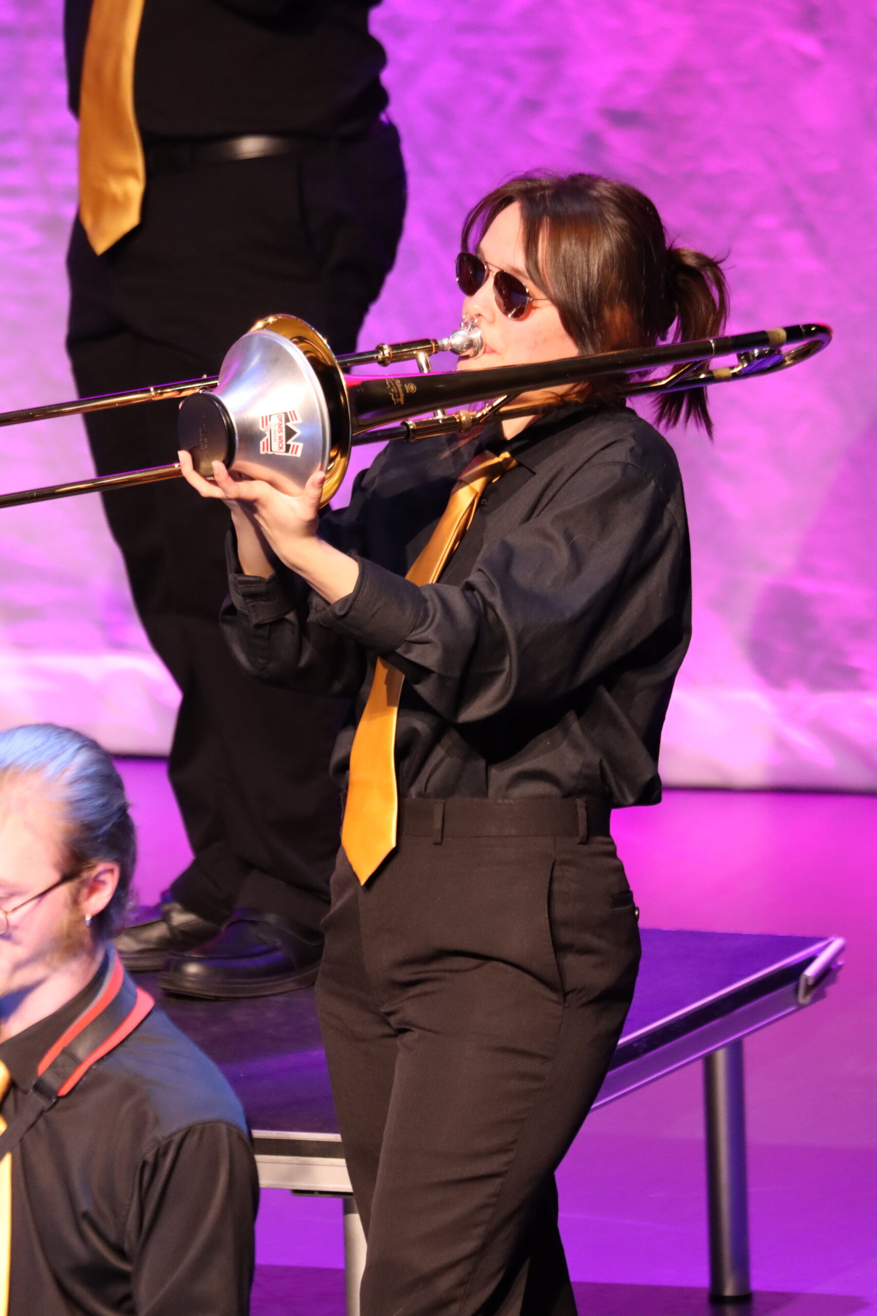 Brianna McFall embodies the rhythm of the night while beautifully playing the Trombone.