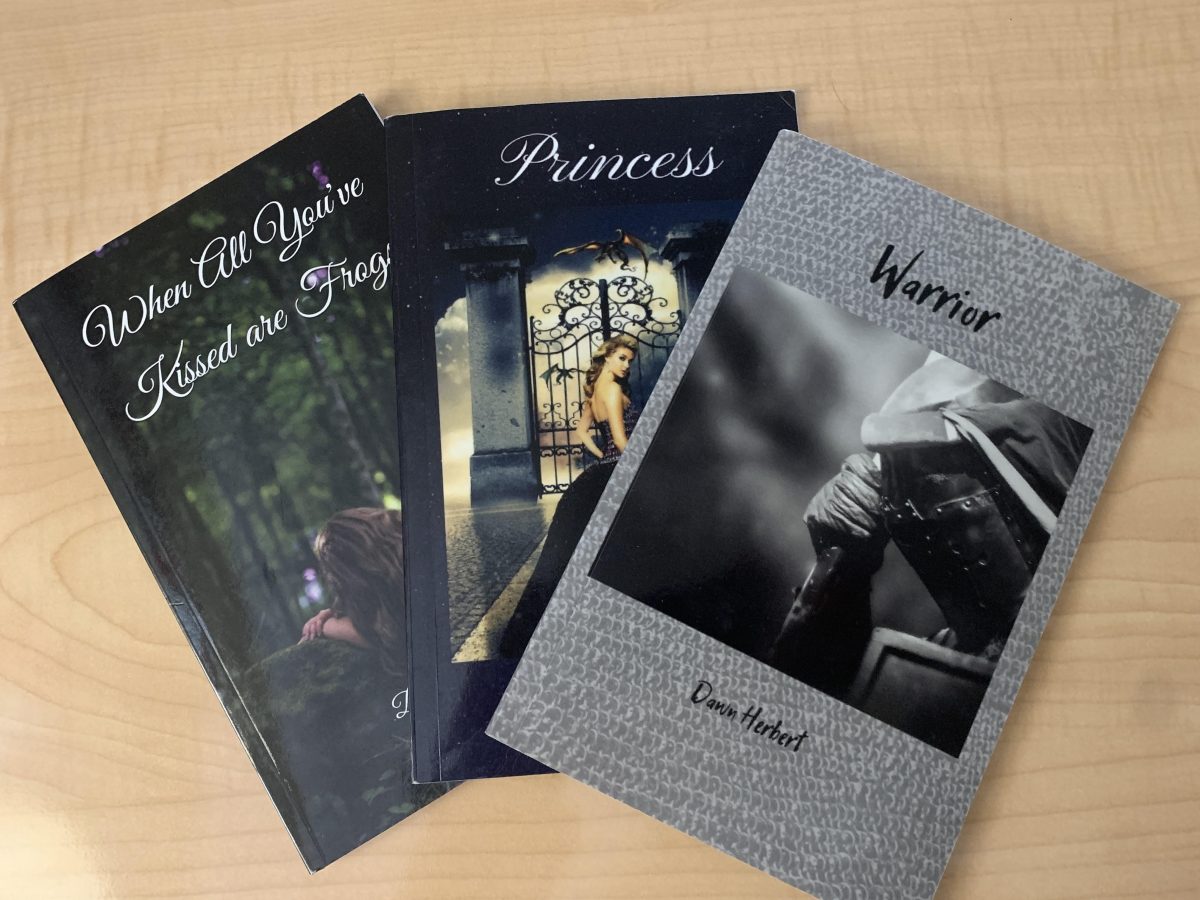 Pictured here are Dawn Herbert's three published books, When All You've Kissed are Frogs, Princess, and Warrior. These books are available for purchase on Amazon. 