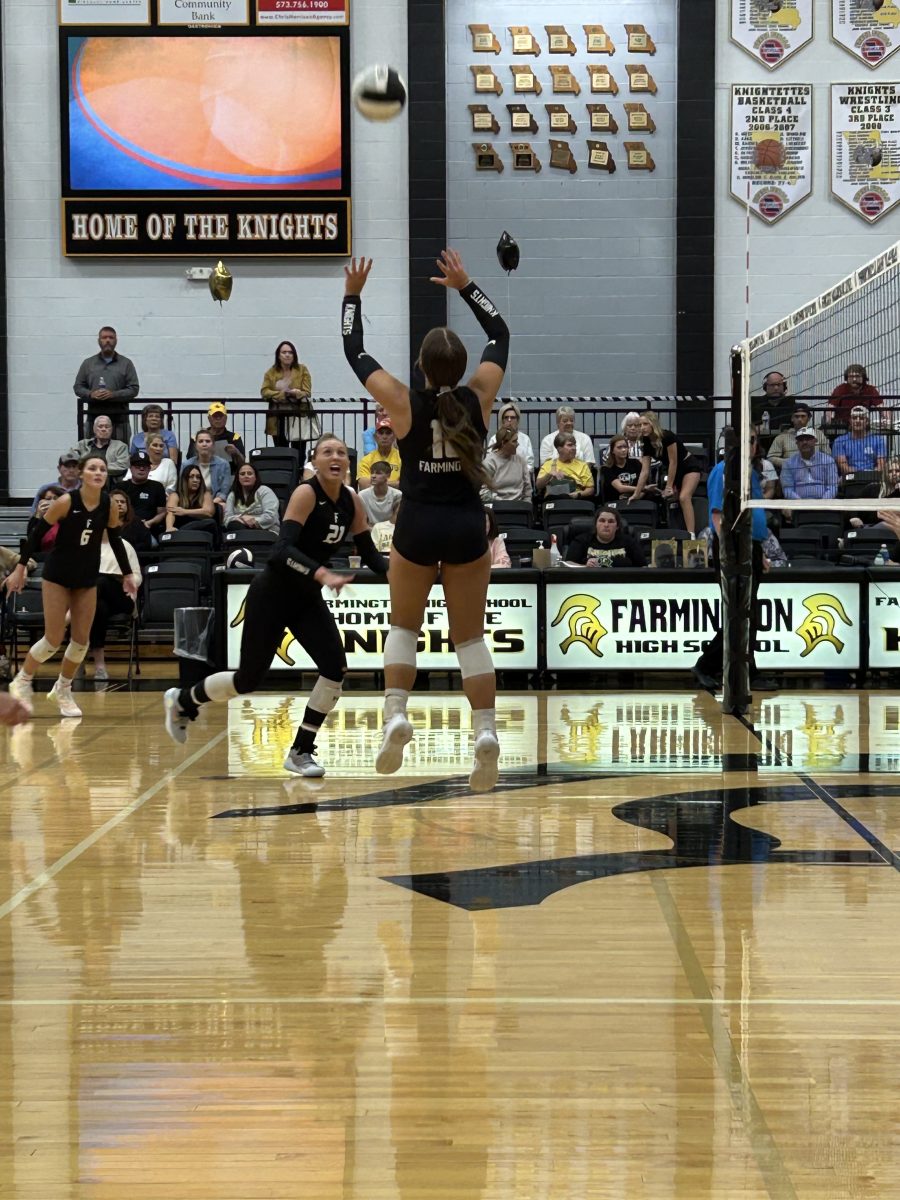 Cheyenne Strohkirch gets ready to set the ball to Ava Cooper. 