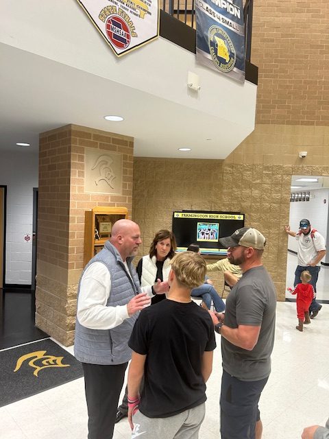 Coach Eckley takes time to meet students and parents one on one.  