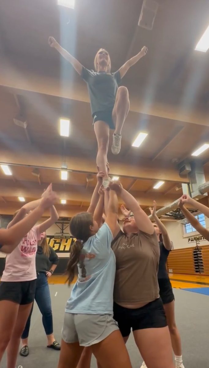 Bryleigh Moore, Kendra Arnett, Alyssa Reynolds, and Shelby Williams doing a "Switch Up Lib" at a STUNT Open Gym