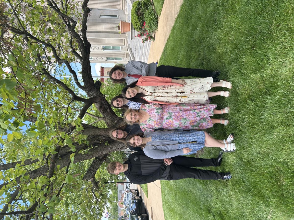 Graduating BKB Staff (Behind Left) Hayden Wade, (Front Left) Jessica Wade, (Behind Middle) Bradley Talley, (Behind Middle Right) Ryker Jones, (Far Behind Right) Brandon Arena, (Front Right) and Lainie Moran with Bank Manager (Middle) Donna Miller.