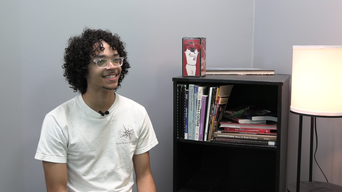 Alexander Kennon smiling for the camera during his interview.