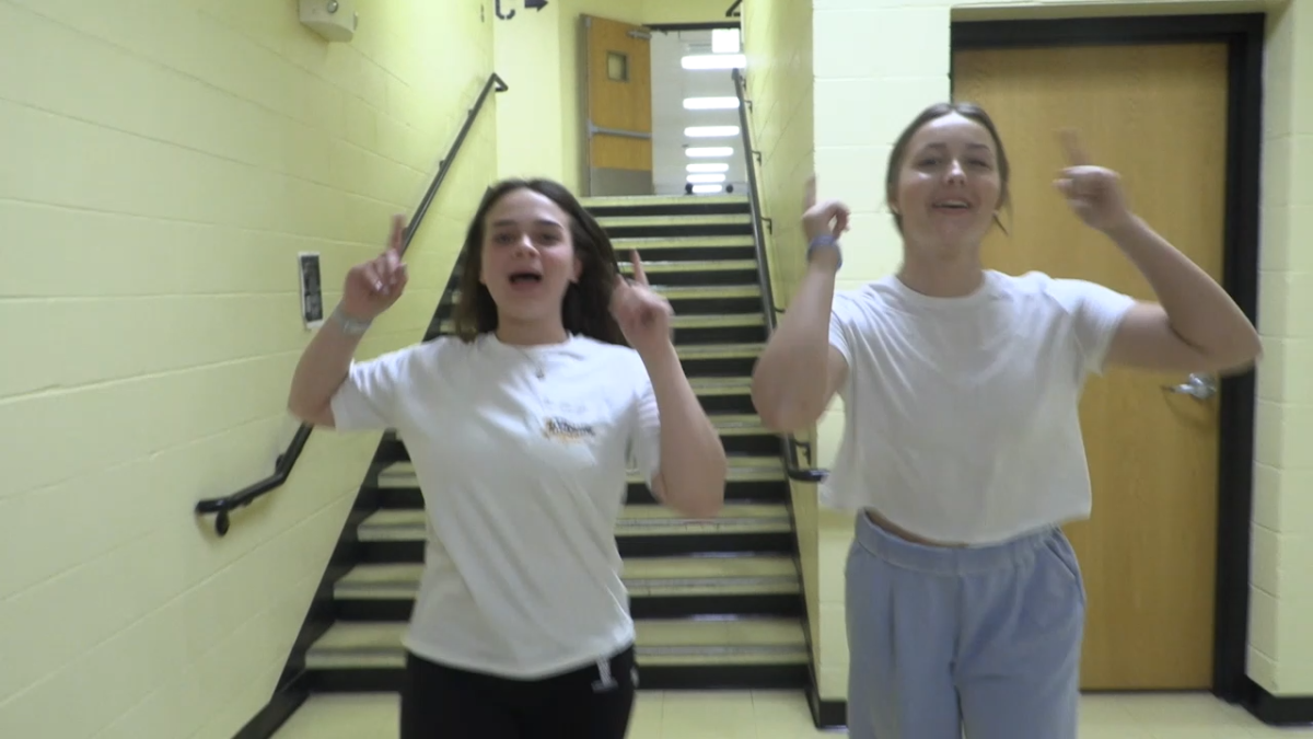 Students Addison Moore (pictured left) and Cheyenne Stokhorst (pictured right) Lip syncing for the lip dub last year at Farmington high school.
