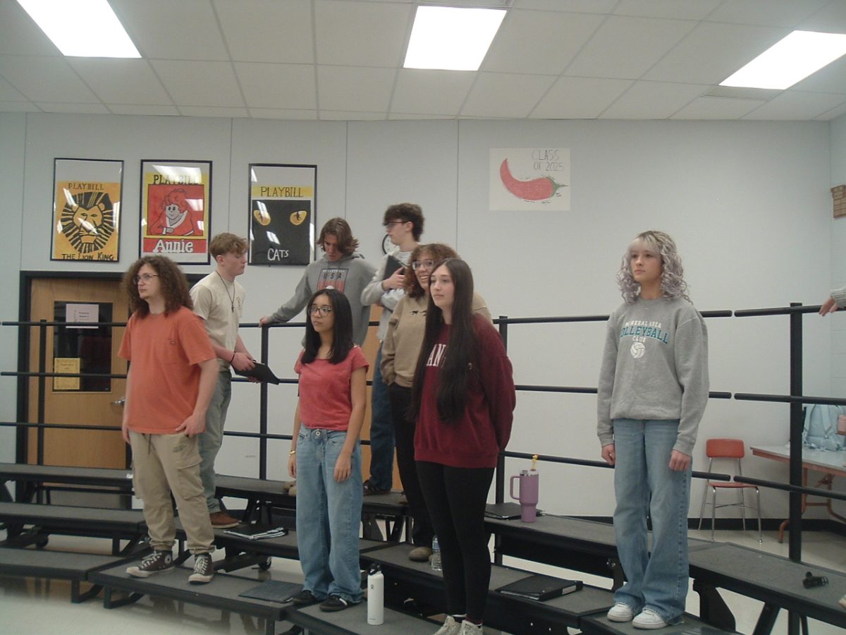 The Choraliers getting their voices warmed up for choir last thursday
